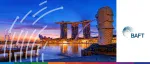The Merlion statue and Marina Bay Sands hotel illuminated at dusk in Singapore, hosting the BAFT 2025 Asia Bank to Bank Forum.