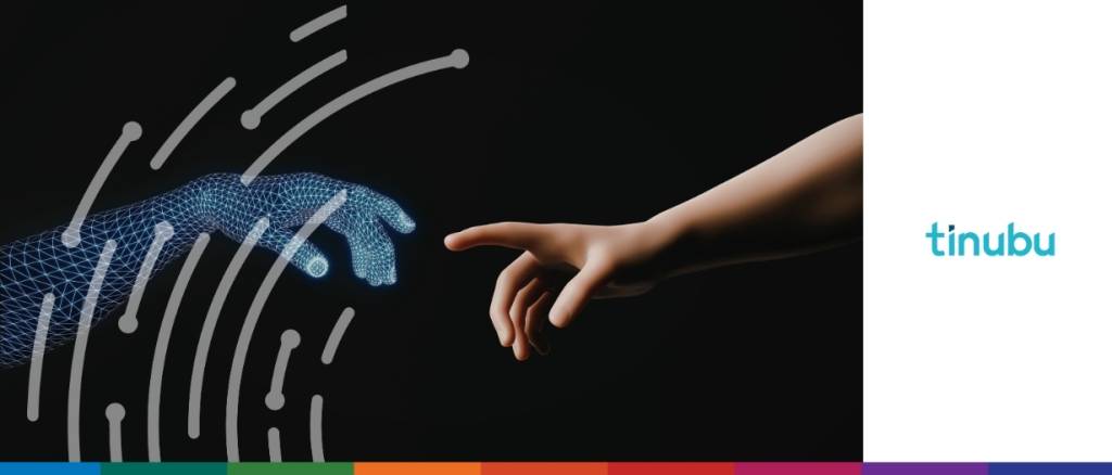 Close-up of a human hand reaching toward a glowing, wireframe AI hand, showing agentic AI in specialty insurance workflows.