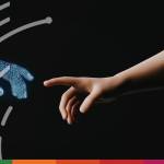 Close-up of a human hand reaching toward a glowing, wireframe AI hand, showing agentic AI in specialty insurance workflows.