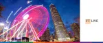 The Hong Kong Observation Wheel and IFC skyscraper illuminated at night, featuring the FT Live logo for the ABS Asia conference.