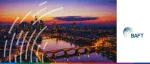 BAFT logo beside a vibrant sunset view of the Frankfurt skyline reflecting in the Main River.
