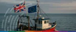 A digital illustration of the UK and EU flags with a legal gavel over a school of sandeels, representing the first TCA arbitration ruling in 2025.