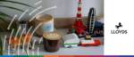 An image of a workspace with coffee, toys, and plants, symbolising balancing work and family life fo.