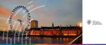 Dusk view of the illuminated London Eye Ferris wheel and County Hall on the South Bank of the River Thames for the EMEA Symposium organized by the Global Association of Women in Payments.