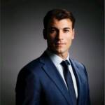 Professional businessman in suit representing trade finance and international business.