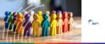 Diverse group of wooden figures representing women in transaction banking.