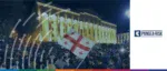 Aerial view of a crowded street protest in Tbilisi, Georgia, highlighting how domestic unrest and geopolitical shifts impact Georgia’s role in the global economy and EU integration.