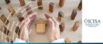 ICISA survey visual: Hands protecting a wooden house structure, illustrating surety bonds and trade credit insurance support for infrastructure and economic resilience.