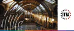 Interior view of the Hintze Hall at the Natural History Museum in London, featuring grand Romanesque arches and stone architecture for the ITFA Educational Seminar.