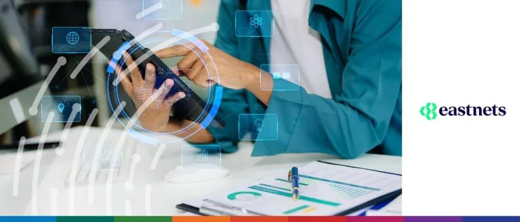 Eastnets professional report cover titled "Instant payments, instant risks: Banks' perspectives in the payments revolution," featuring a person using a tablet to analyze financial data charts.