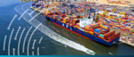 Container ship navigating through port with cargo containers.