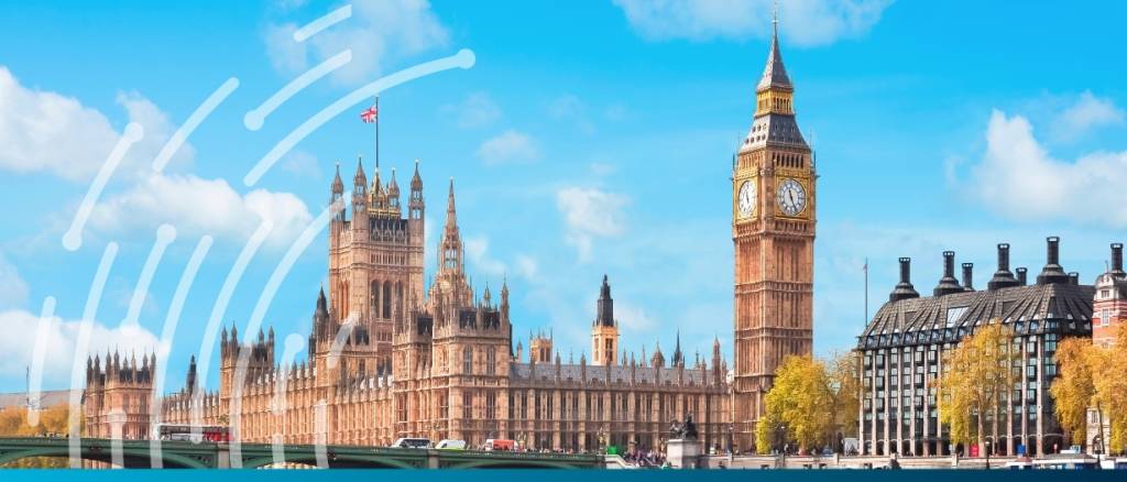 The Houses of Parliament and Big Ben in London under a bright blue sky, as Parliament debates a bill to double the UK Export Finance (UKEF) budget