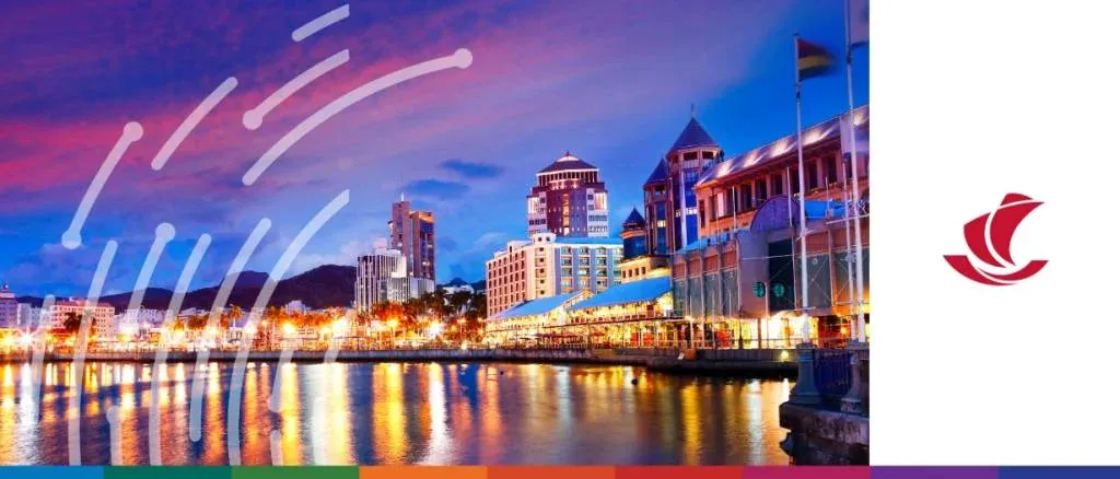 Night view of the Port Louis waterfront in Mauritius, symbolizing the country’s journey as a hub for pan-African economic growth and financial services.