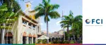 Daytime view of a Spanish-style resort with palm trees and a bright blue sky for the FCI article on supporting SMEs within the financial supply chain through reverse factoring.
