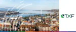 Daytime aerial view of the Geneva skyline, Lake Geneva, and the Jet d