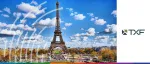 TXF logo beside a bright daytime view of the Eiffel Tower in Paris under a blue sky with white clouds.