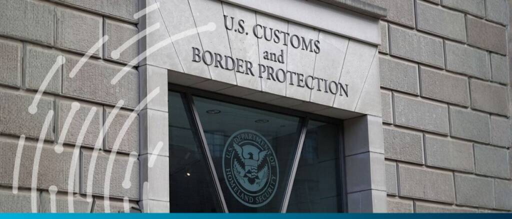 U.S. Customs and Border Protection office entrance with sign.