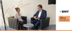 BNY interview at Sibos Frankfurt featuring a discussion on anti-fraud in the payments sphere with a man and woman in a studio setting.