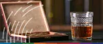 A digital graphic of a smartphone scanning a DataMatrix code on a cigarette pack and wine bottle, representing Ukraine