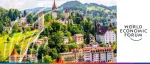 Lush green hillside view of the historic Musegg Wall and its watchtowers in Lucerne, Switzerland, for the World Economic Forum Annual Meeting.