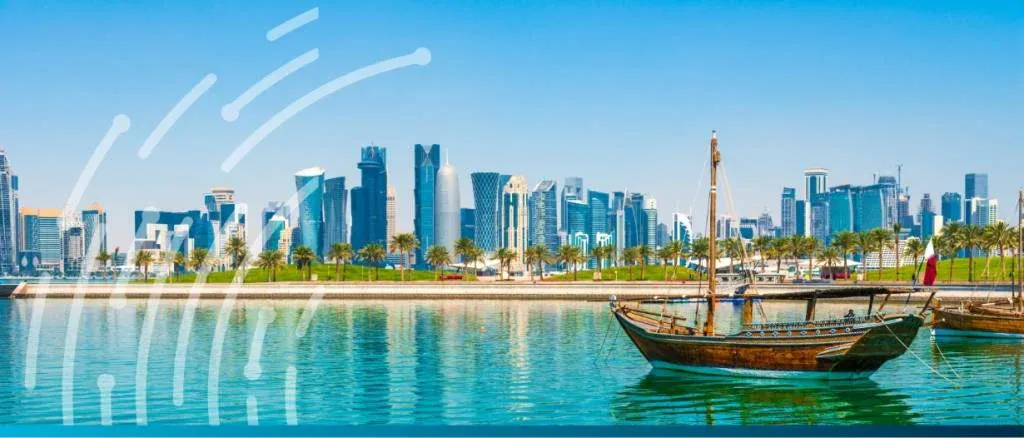 Panoramic view of Doha, Qatar, representing the country's status as a leading trade and financial hub and its 2026 growth trajectory.