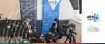 Saibo Jin and an industry expert being filmed for an interview at ICC Austria, featuring "Your Partner in International Trade and Law" branding and Trade Finance Global logos.