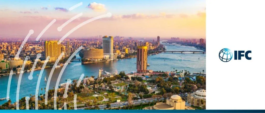 A high-angle view of the Cairo skyline along the Nile River at sunset, representing the International Finance Corporation (IFC) and its commitment to private sector growth in Egypt.
