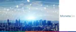 A panoramic cityscape of a modern financial district at sunrise, overlaid with a glowing digital web of international currency symbols and the MonetaGo logo to represent secure global payment networks.