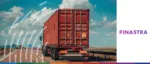Cargo container truck driving on an open highway, representing global supply chain management, cross-border trade, and digital finance solutions by Finastra.